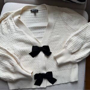 Express Cream Cardigan with Black Bow Details